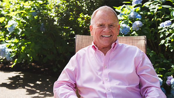 Terre sitting in a chair outside in the sunshine